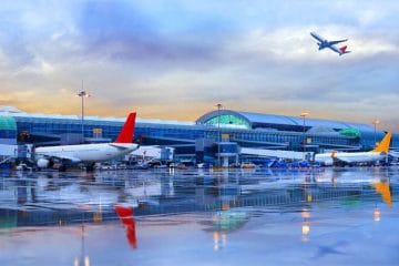 An airplane at an airport's runway after a downpour