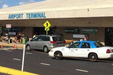 A police car is parked in front of Trenton airport terminal.