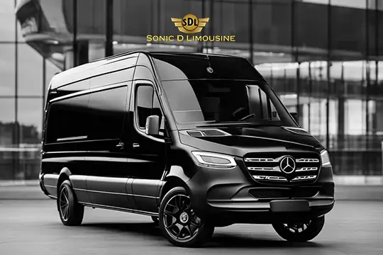 Sonic D Limousine Worldwide Voted Most Reliable Airport Transportation Provider! A black Mercedes-Benz Sprinter van with "Sonic D Limousine Luxury Airport Transportation" signage on top, parked in front of a modern glass building. Sonic D Limousine Worldwide your luxury Airport Transportation