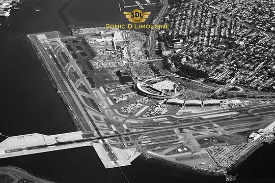 Sonic D Limousine Worldwide Voted Most Reliable Airport Transportation Provider! Aerial view of an airport with runways, terminals, and surrounding residential area. The image has "Sonic D Limousine Luxury Airport Transportation" text and logo at the top center. Sonic D Limousine Worldwide your luxury Airport Transportation