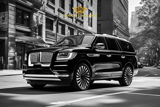 Sonic D Limousine Worldwide Voted Most Reliable Airport Transportation Provider! A black luxury SUV is parked on the street in an urban setting, with the logo "Sonic D Limousine" visible above. The vehicle has a sleek design and is positioned in front of a row of buildings, epitomizing premium airport transportation. Sonic D Limousine Worldwide your luxury Airport Transportation