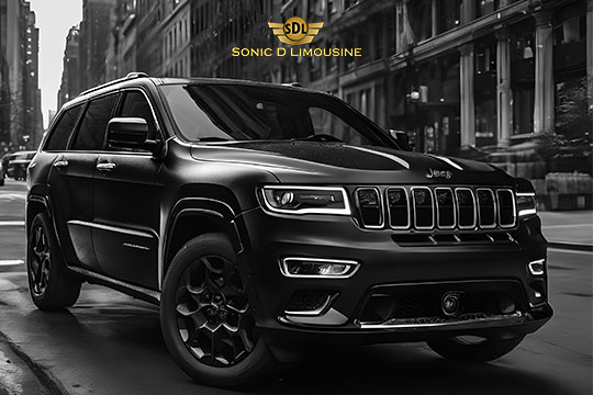 Sonic D Limousine Worldwide Voted Most Reliable Airport Transportation Provider! The Black Jeep Grand Cherokee, boasting the Sonic D Limousine logo above it, exudes the elegance of Sonic D Limousine's Luxury Airport Transportation as it parks gracefully on a busy city street. Sonic D Limousine Worldwide your luxury Airport Transportation