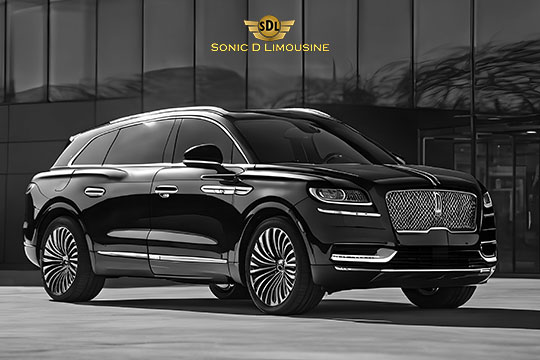Sonic D Limousine Worldwide Voted Most Reliable Airport Transportation Provider! A sleek black luxury SUV from Sonic D Limousine Luxury Airport Transportation is parked in front of a modern building with reflective glass windows. The Sonic D Limousine logo is prominently displayed at the top. Sonic D Limousine Worldwide your luxury Airport Transportation