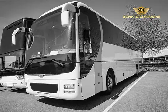 Sonic D Limousine Worldwide Voted Most Reliable Airport Transportation Provider! Black and white photo of two parked buses with "Sonic D Limousine Luxury Airport Transportation" logo in the top right corner. Sonic D Limousine Worldwide your luxury Airport Transportation