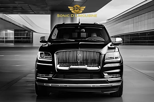 Sonic D Limousine Worldwide Voted Most Reliable Airport Transportation Provider! A black luxury SUV with a prominent grille and daytime running lights, parked in front of a modern building, features the "Sonic D Limousine Luxury Airport Transportation" logo above it. Sonic D Limousine Worldwide your luxury Airport Transportation