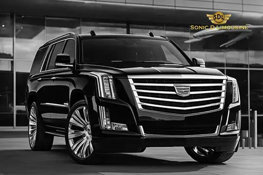 Sonic D Limousine Worldwide Voted Most Reliable Airport Transportation Provider! A black luxury SUV is parked in front of a modern building. The logo "SDL Sonic D Limousine Luxury Airport Transportation" is at the top right corner. Sonic D Limousine Worldwide your luxury Airport Transportation